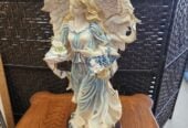 Angel figurine hard plastic with wood base 23 inches tall $30